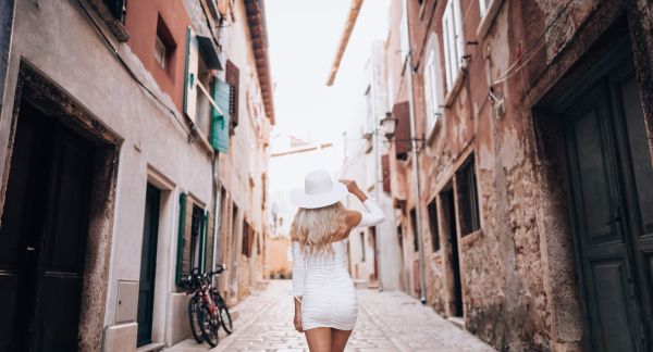 Beautiful Young Woman Walking in the Croatian City of Rovinj Free Photo