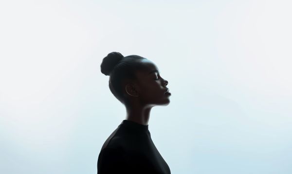 Editorial Photo of Young Black Woman Against White Background Free Image