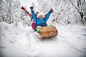 Kids tobogganing on Christmas