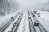snow covered highway in austria with cars out of focus
