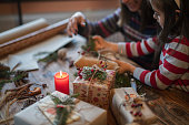 Happy Family Making Christmas Gifts At Home.