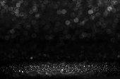Silver and black glitter bokeh background for black friday design,