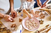 Close-up of a family making cookies from a dough