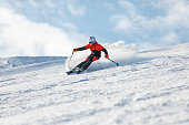 Teenage boy spending winter holiday skiing in mountain