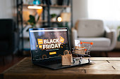 Online shopping on laptop during black friday sales