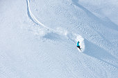 Skier skiing off-piste on a beatiful mountain slope