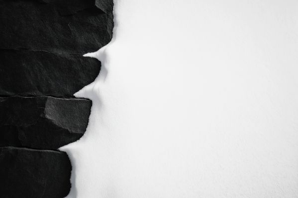 Minimalist Background of White Snow on Black Wall Free Image