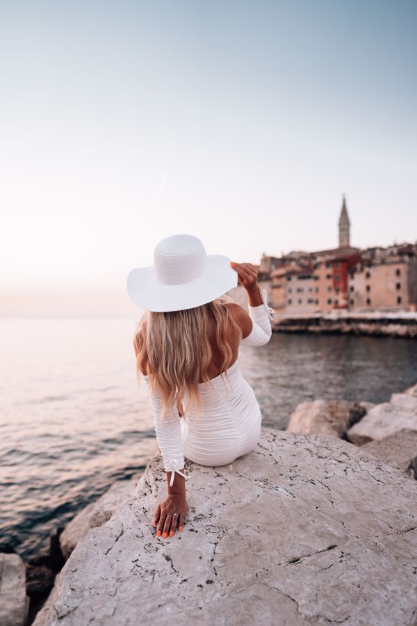 Woman in White Dress Looking at Beauty of Rovinj Free Photo